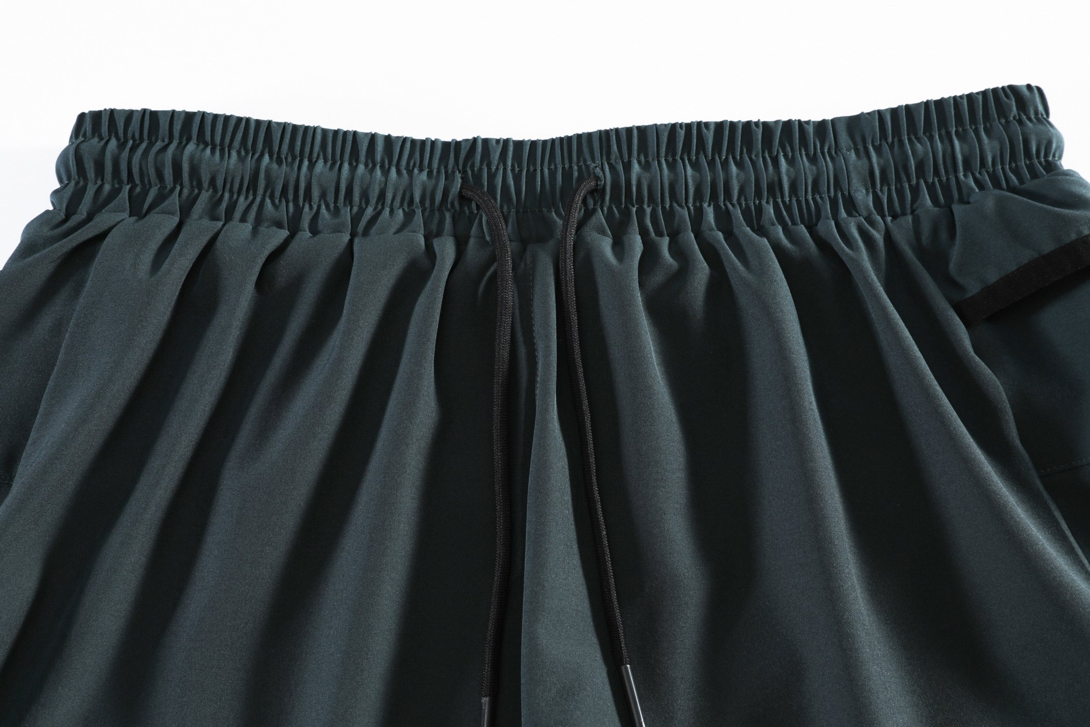 Drawcord waistband and secure rear-zip construction